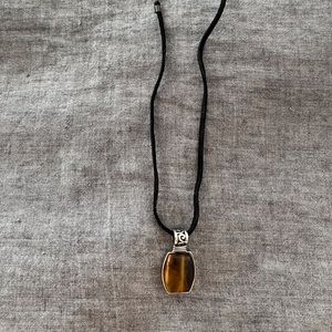 Nice soft rope necklace with pendant. Pretty brown tiger like stone